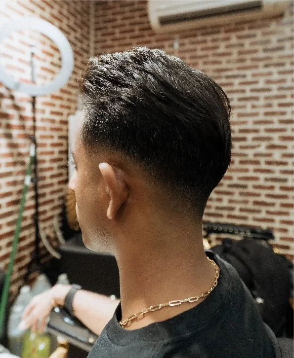 Skullfade barber finishing a fade at the Nassau Street shop in Lower Manhattan