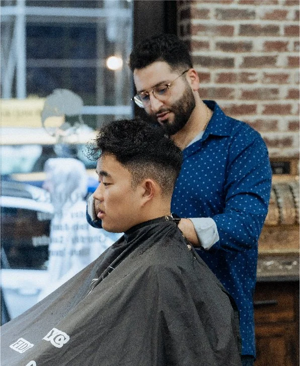 Skullfade barber finishing a fade at the Nassau Street shop in Lower Manhattan