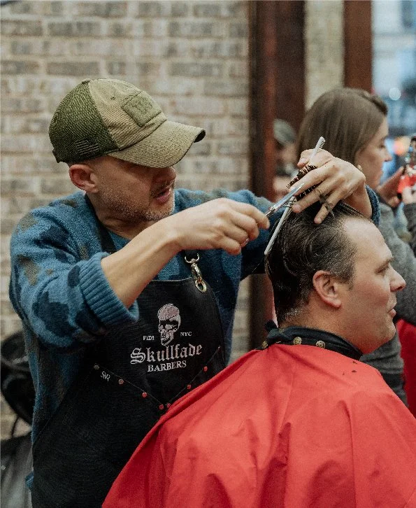 Skullfade barber finishing a fade at the Nassau Street shop in Lower Manhattan